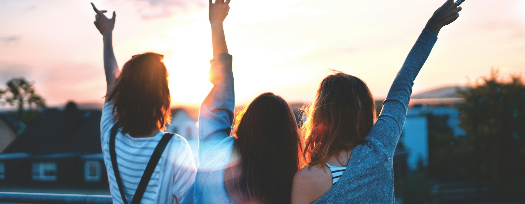 friends looking at a sunset